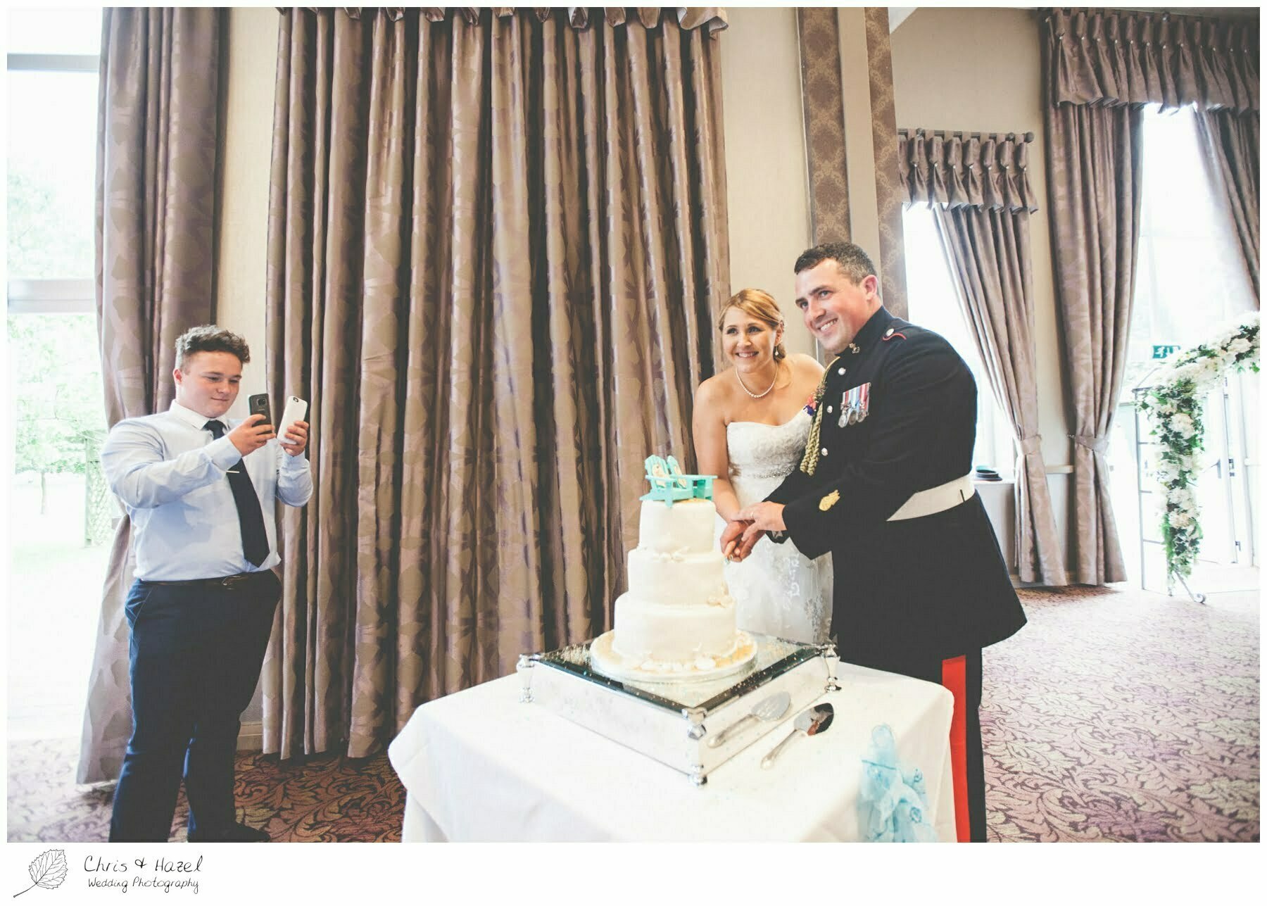 Bride and groom cake cutting, documentary wedding photographs, Barnsley wedding photographer, barnsley wedding photography, burntwood court hotel wedding photography, west Yorkshire wedding photography, chris and hazel wedding photography, simon Devonport, Rebecca silcock, Rebecca Devonport,